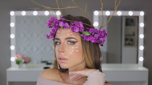 Glamorous Woman Wearing Creative Deer Makeup in Studio