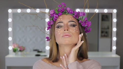 Woman with Flower Crown and Painted Face Posing