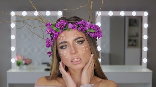 Woman in Flower Crown Posing in Front of Mirror