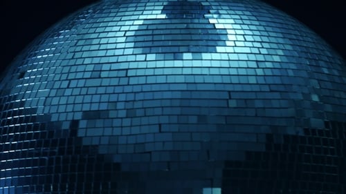 Mirror Disco Ball in the Center of a Spin on a Black Background