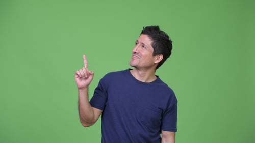Hispanic Man Thinking While Pointing Up