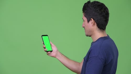 Hispanic Man Using Phone