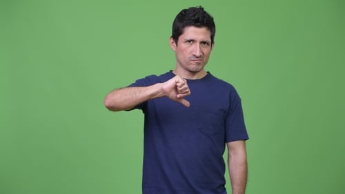 Man Gives Thumbs Down on Green Screen