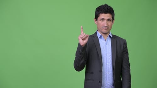Hispanic Businessman Pointing Finger Up