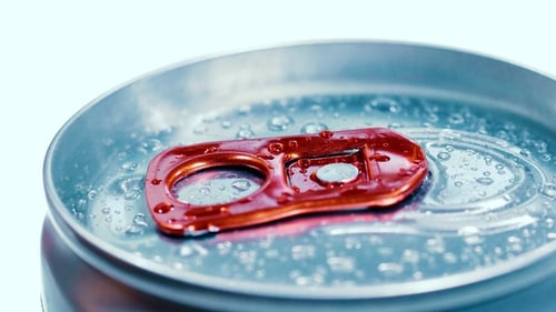 Aluminum Soda Tin Can Lid Cover of Soft Drink on Ice Goes Around the Circle