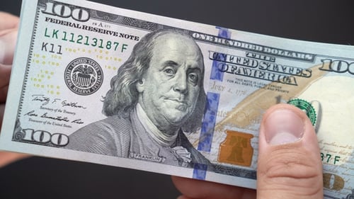 Counting Stack of United States Hundred Dollar Bills