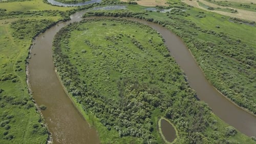 Flying Over the Beautiful River and Green Fields