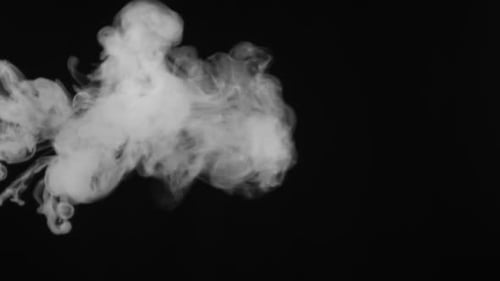 Abstract White Smoke Billowing on Black Background