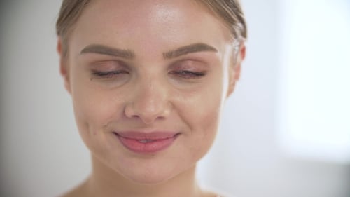 Woman Taking Vitamin Supplement Pill Smiling