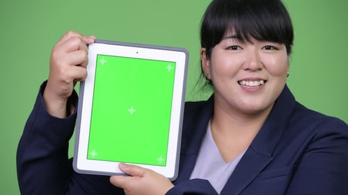 Woman Holding Tablet with Green Screen Display