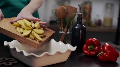 Preparing Potatoes for Baking in Kitchen