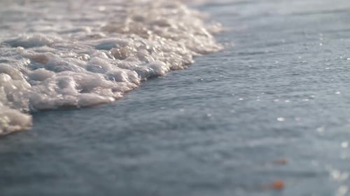 Foamy Waves Rolling in on the Sea Shore