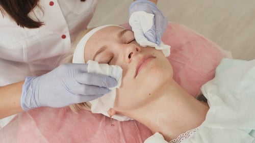 Woman Receiving Facial Treatment at Beauty Salon