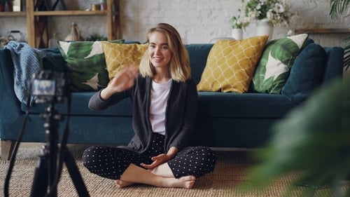 Woman Recording Video for Blog in Living Room