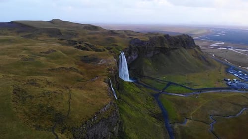 Waterfalls in green mountainous terrain