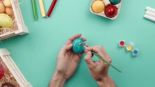 Decorating Easter Eggs with Paint and Brush