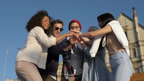 Friends Team Building Putting Their Hands on Each Other