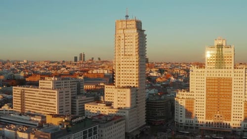 Forwards Rising Footage of Old High Rise Buildings at Spain Square with Cityscape in Background at