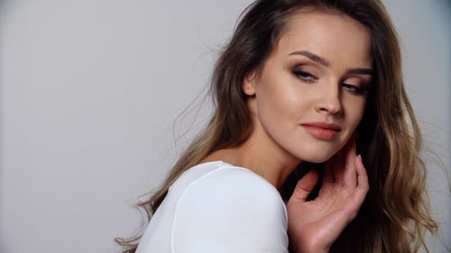 Beautiful Woman Posing in White Studio Close Up