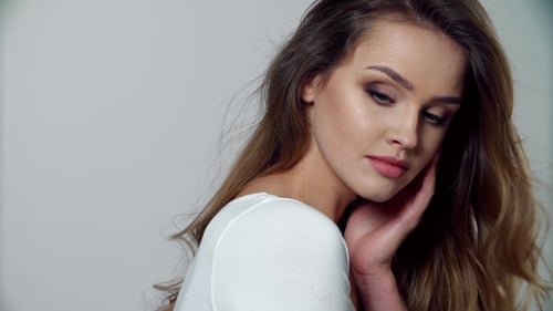 Beautiful Woman Posing with Elegant Hair and Makeup