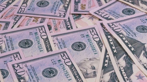 Panning Shot of US Fifty Dollar Bills