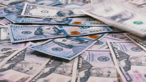 American Dollars Bills of Different Denominations Fall on the Table