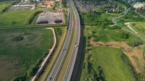 Aerial View Of A Freeway. Descending Shot Cars Driving By the Road. Traffic on the Highway