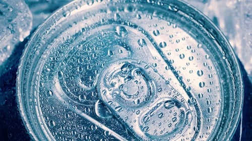 Aluminum Soda Tin Can Lid Cover of Soft Drink on Ice Goes Around the Circle