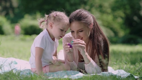 Mother And DaughterHaving Fun At Park
