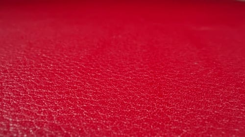 Crimson Color Cow Leather Material As Background Macro View
