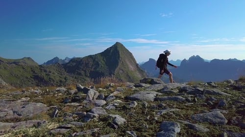 Woman Hiking on Mountain Ridge in Wilderness
