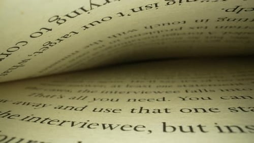 Macro Shot of Book Pages with Dark Text