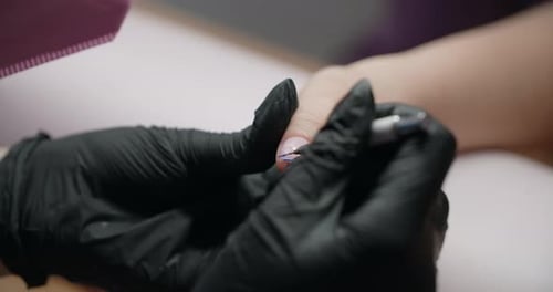 Manicurist Applies Blue Nail Polish Close Up