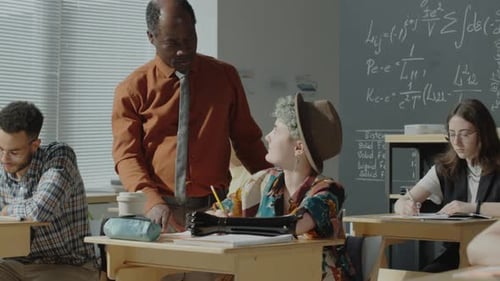 Professor Helping Girl with Test at University