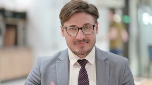 Successful Mature Adult Gives Thumbs Up