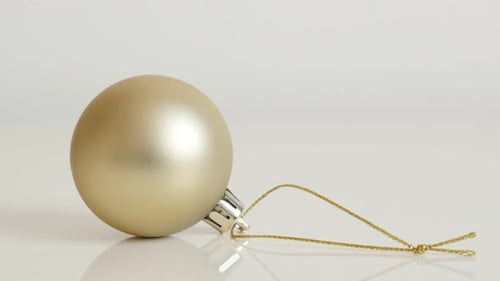 Round matte golden color bauble 4K 2160p 30fps UltraHD footage - Shiny Christmas ornament close-up 3