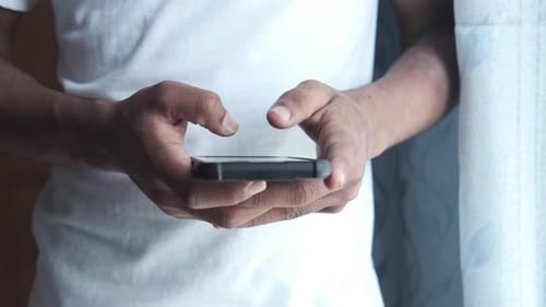 Adult Hands Using Mobile Smartphone Device