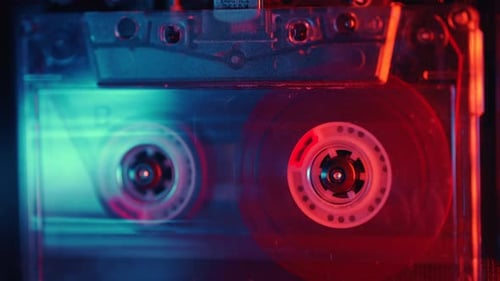 Cassette Tape Spinning with Red and Blue Lighting