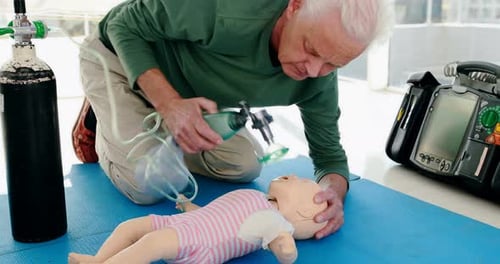 Man Performing CPR on a Doll