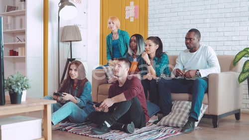 Friends Playing Video Games Together at Home