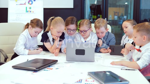 Office and the Concept of Teamwork a Group of Business Children at a Meeting