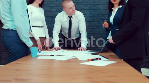 Team of Six Multi Ethnic Business People in City Clothes Meeting in a Modern Office Boardroom