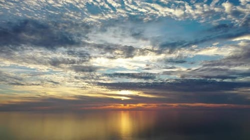 Sunset Over the Sea Flew Away on a Drone in the Sun