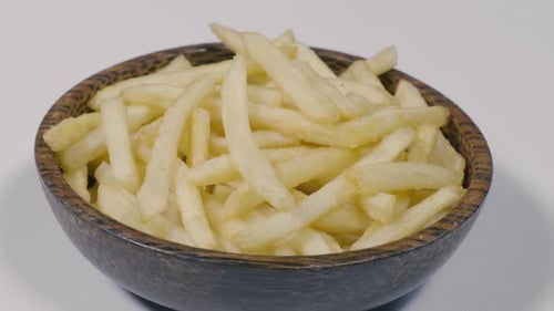 Wooden Bowl Full of Golden French Fries