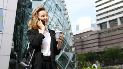Businesswoman Talking on the Phone in Urban Setting