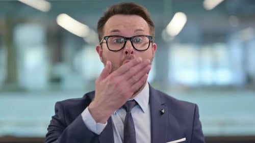 Surprised Man in Suit Reacting to News