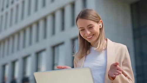 Woman on Video Call Outside Office Building