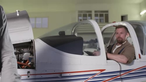 Maintenance Technicians Working in Hangar Together