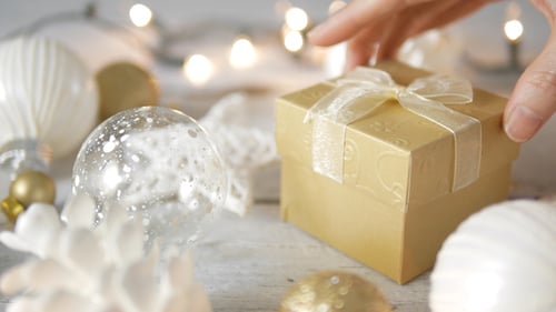 Christmas Ornaments and a Gold Present Close Up