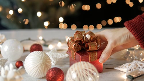 Festive Christmas Ornament Arrangement with Added Gift